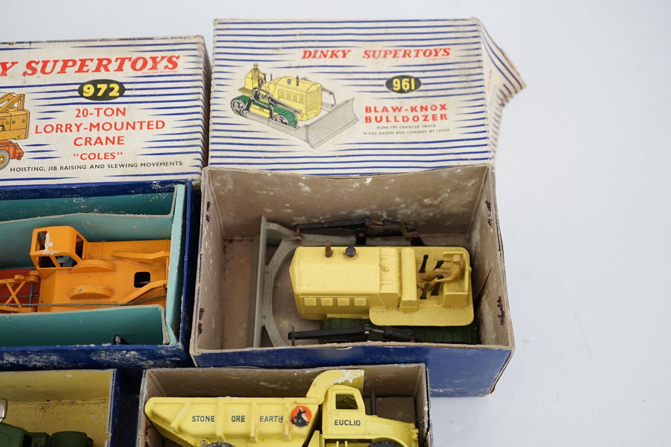 Thirteen Dinky Toys and Supertoys, etc. including; an MGB (113), a Riley Pathfinder, a Triumph Herald, an Armoured Command Vehicle (677), a 20-ton Mounted Crane (972), a Recovery Tractor (661)